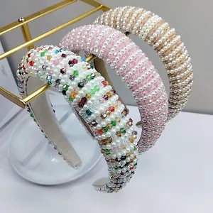 Detail view of pearl and crystal embellished headband with thick sponge padding base