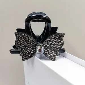 Pince à cheveux papillon noire élégante avec strass pour coiffure de femme
