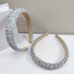 Luxe rhinestone and pearl sponge headband with sparkling crystals and beige velvet lining