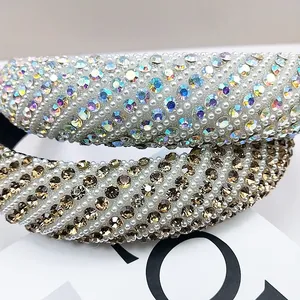 Detailed close-up of padded headbands with colorful rhinestones and white micro pearls