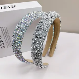 Close-up of wide padded headbands with dense rhinestones and soft anti-slip lining