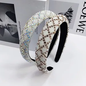 Padded headband with full pearls and rhinestones shown in a 45-degree angled view