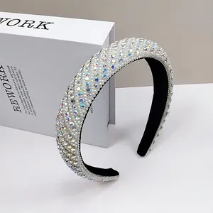 Detailed side view of luxury headband featuring sparkling rhinestones and white pearls