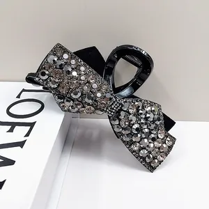 Elegant black bow hair claw clip with sparkling rhinestones for women hair styling