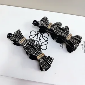 Elegant black bow banana clip with sparkling rhinestones and gold LOVEDAYS metal buckle