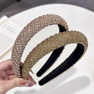 Sparkling rhinestone headband set in champagne gold and rose pink colors for women