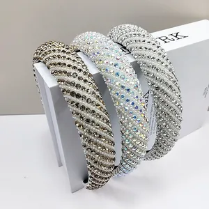 Close-up of luxury padded headbands featuring sparkling rhinestones and elegant pearls