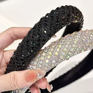 Luxe padded headband with shimmering rhinestones in black and iridescent AB colors
