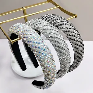 Close-up of three luxury sponge headbands with sparkling rhinestones in various colors