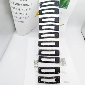 Set of 10 black rectangular fabric-wrapped BB hair clips with colorful rhinestones