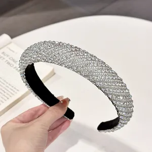 Detailed view of padded rhinestone headband with crystal embellishments and velvet lining