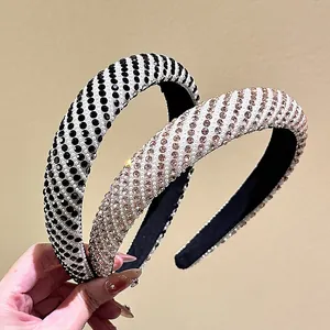 Sparkling rhinestone and pearl padded headband with elegant crisscross patterns