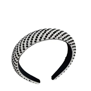 Fashionable pearl rhinestone headband with black and white diagonal pattern in a wide design