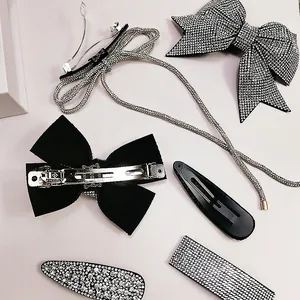 Set de pinzas para el cabello con lazos de diamantes de imitación y terciopelo