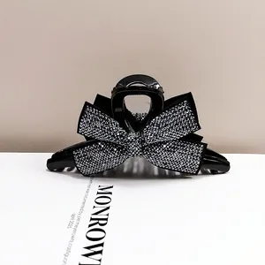 Grande pince à cheveux nœud noir élégante avec strass argentés pour coiffure de mariage