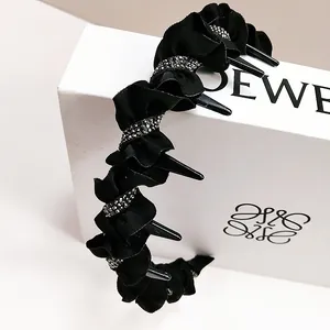 Detail of black wave headband with sparkling rhinestones and inner non-slip hair teeth