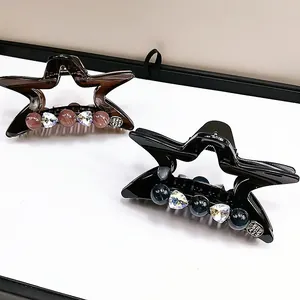 Pinza per capelli a stella con ciondoli a cuore in cristallo e perline in ambra e nero