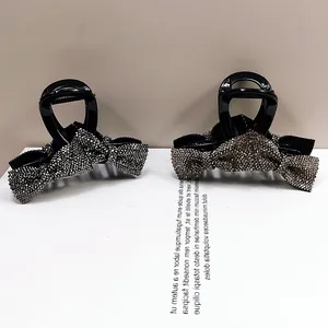 Sparkling rhinestone bow hair claw clips with elegant crystal accents for women's updos