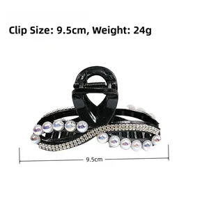 Dettaglio molletta per capelli nera 9,5 cm con perle colorate e strass luccicanti