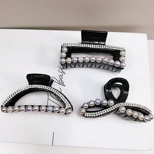 Set di tre mollette nere per capelli con strass scintillanti e perle sintetiche