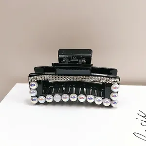 Elegante pinza per capelli nera con strass e perline per acconciature da donna raffinate