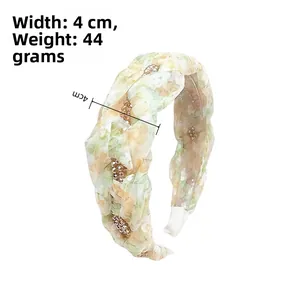Detail view of floral headband with 4cm width, 44g weight, and crystal embellishments