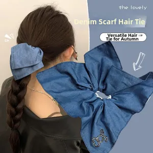 Elastico per capelli in denim blu scuro con grande fiocco e motivo in strass chic