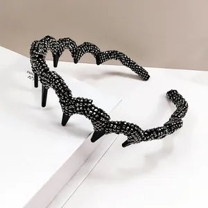 Detail shot of wavy headband featuring silver grey rhinestones and anti-slip teeth