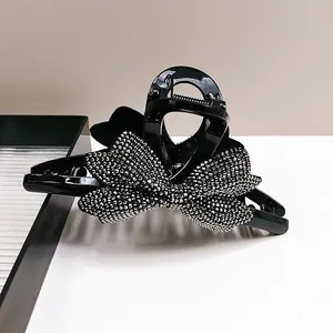 Elegante pinza per capelli a fiocco nero con strass brillanti per acconciature da donna