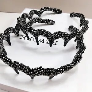 Detail of wavy black headbands with silver crystal sand finish and non-slip inner teeth