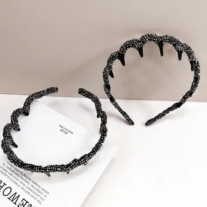 Elegant wavy black crystal headbands with anti-slip teeth shown in a stylish setup
