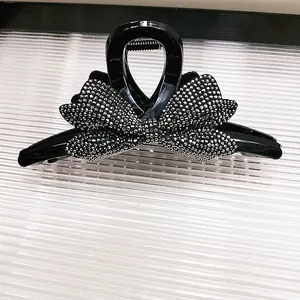 Elegante molletta per capelli a fiocco nero con strass brillanti per acconciature