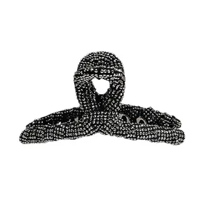 Elegant large black claw clip with full silver rhinestones for a sophisticated hairstyle