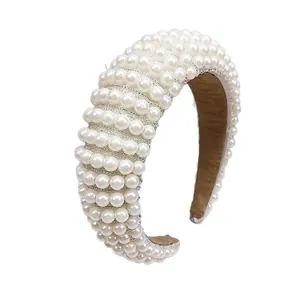 Baroque elegant wide sponge headband with white pearls for women on white background