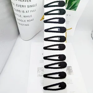 Set of 10 classic black fabric wrapped snap hair clips on a white display card