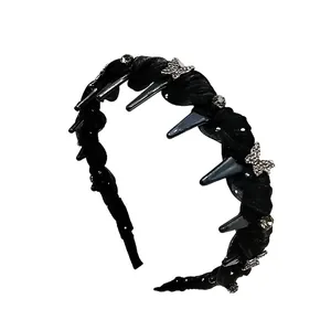 Serre-tête noir élégant avec papillons en strass argentés et dents intérieures pour maintien