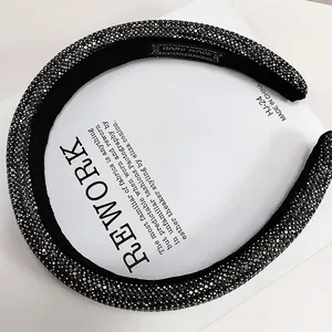 Detail of luxury rhinestone headband with handmade woven label and black velvet lining