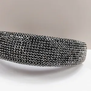 Macro shot of the luxury black rhinestone headband with detailed crystal embellishment