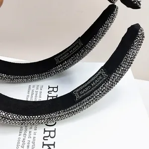 Macro shot of the handmade black velvet headband with sparkling silver-grey rhinestones