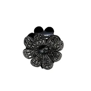 Pince à cheveux élégante fleur strass noir avec grande pierre centrale pour femme