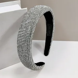Detail of hand made headband with silver rhinestones and soft black velvet inner lining