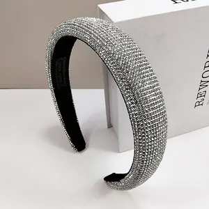 Macro shot of silver rhinestone headband featuring thick sponge padding and handmade finish
