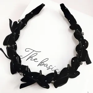 Elegant black velvet woven headband with butterfly bows and silver bead accents