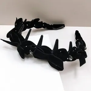 Fashionable black velvet headband with gothic tooth design and sparkling rhinestones