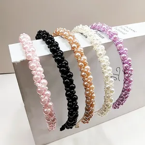 Close-up of luxury handcrafted pearl headbands in five elegant pastel colors