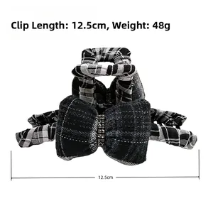 Detail of 12.5cm checkered bow hair claw clip with rhinestones and size measurements
