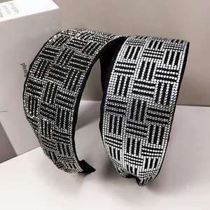 Detail of wide sparkling rhinestone headbands with silver geometric crystal weaving