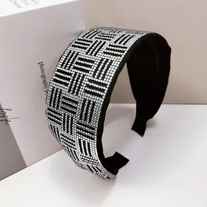 Elegant wide headband with sparkling silver rhinestones in a geometric woven pattern