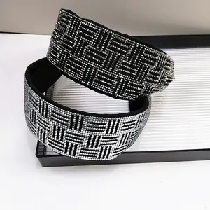 Elegant wide headbands set with sparkling rhinestones in black and silver woven patterns