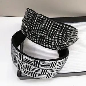 Detailed view of luxury rhinestone headbands with geometric diamond weave patterns